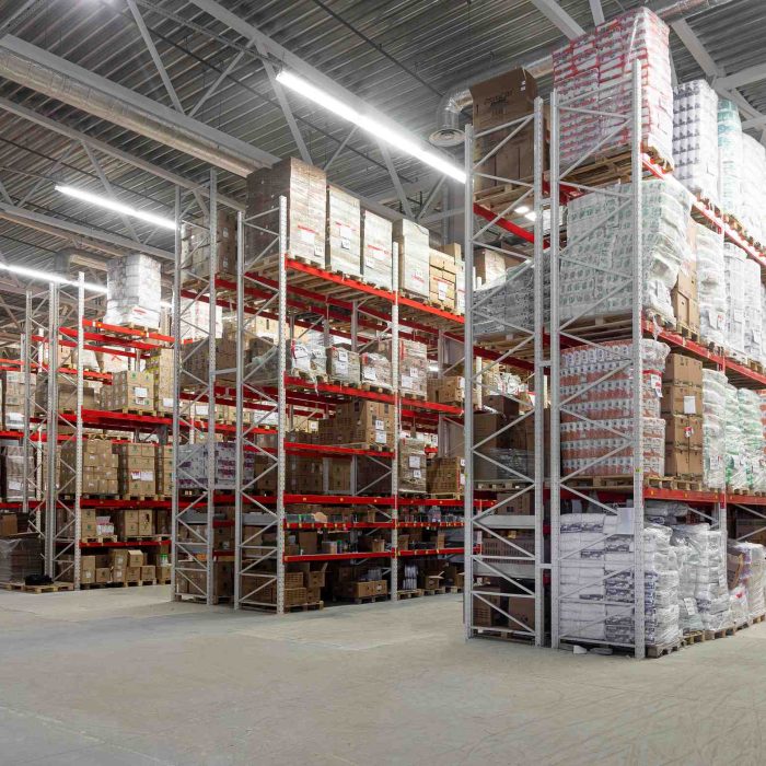 The territory of a large logistics center with racks for storing goods before being sent to the sender.